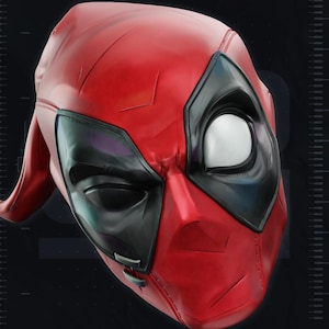 May include: A red and black full-face mask featuring a smooth, molded surface with large, white, almond-shaped eye lenses outlined in black. The mask displays the text MIX EYES at the top and has a distinct, contoured shape with visible seam lines.