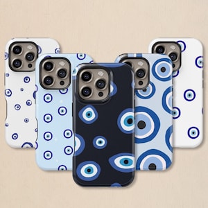 May include: A collection of five phone cases with various blue and white evil eye patterns. The cases feature a range of designs, including scattered eyes, repeating patterns, and a dark blue case with multiple eyes. The cases are designed to fit a smartphone.