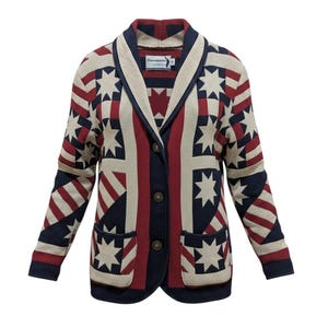 May include: A long-sleeve knit cardigan featuring a shawl collar and a repeating geometric pattern in navy blue, cream, and dark red. The design includes eight-pointed star motifs and striped sections. It has three front buttons and two pockets.