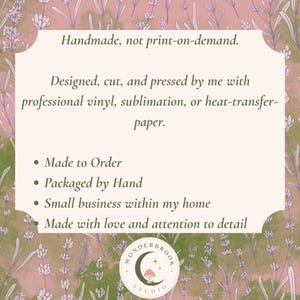 May include: A rectangular informational sign with a light cream background and a lavender floral border. The text reads: Handmade, not print-on-demand. Designed, cut, and pressed by me with professional vinyl, sublimation, or heat-transfer-paper. Made to Order, Packaged by Hand, Small business within my home, Made with love and attention to detail. A circular logo at the bottom features a crescent moon, a mushroom, and the text WONDERBROOK STUDIO.