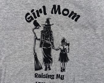 Girl Mom Raising Little Witch Graphic Tee, Comfort Colors Shirt, Girl Mama Shirt, Spooky Girl Mama, Handmade Spooky Gothic Mom T-Shirt