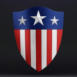 May include: A shield design with a blue upper section, displaying three white stars. The lower part features alternating red and white vertical stripes. The shield has a curved top and a pointed base, with a glossy finish.