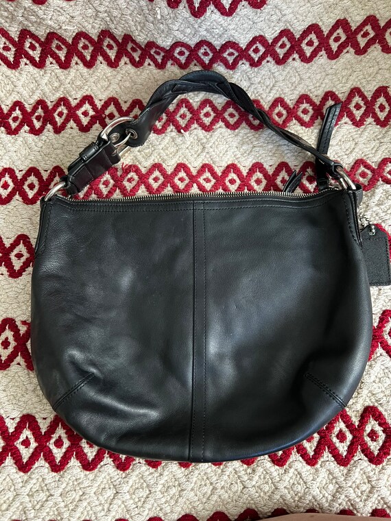 Black leather coach purse with silver hardware shop