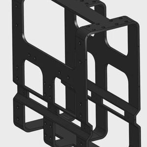 May include: A black metal bracket with a rectangular frame design. The bracket has multiple rectangular openings and is constructed with curved edges and visible screw holes. The overall structure appears to be a support or mounting component.