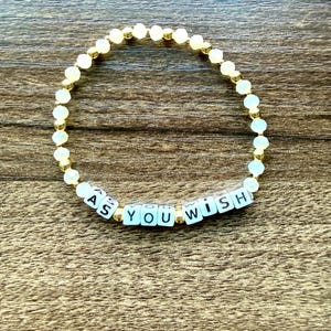 May include: A set of three ceramic mugs with a speckled, matte finish. The mugs are in shades of cream, light gray, and dark gray. Each mug has a simple, minimalist design, perfect for coffee or tea.