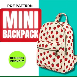May include: A mini backpack with a white background and a pattern of red strawberries. The backpack has a front pocket and a top handle. Text on the image reads "PDF PATTERN" and "MINI BACKPACK". A green circle says "BEGINNER FRIENDLY".