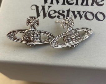 Pendientes de cristal Planet Orb de Vivienne Westwood en caja