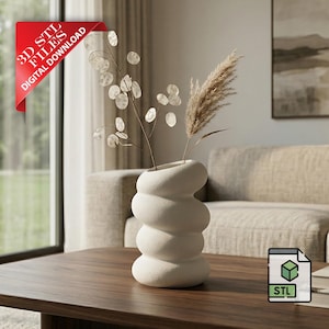 May include: A white, textured vase with a unique, stacked design holds dried flowers and foliage. The vase sits on a dark wood coffee table. A red banner in the corner reads "3D STL FILES DIGITAL DOWNLOAD".