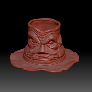 May include: A reddish-brown, stylized Sorting Hat sculpture with a face, wide brim, and a cylindrical crown. The hat has a textured surface with stitched details and a stern expression. The hat is a prop from a fantasy series.
