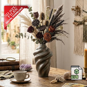 May include: A decorative arrangement of dried flowers in a bronze-colored vase. The bouquet includes roses, thistles, and pampas grass. A cup and saucer, books, and a candle are on the wooden table. The image includes a red banner that says "3D STL FILES DIGITAL DOWNLOAD".