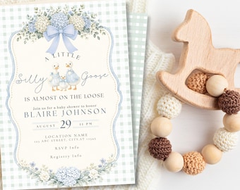 May include: A rectangular baby shower invitation card featuring a light blue gingham background, a central illustration of three geese, blue floral accents, and a large blue bow. The text reads A LITTLE Silly Goose IS ALMOST ON THE LOOSE.