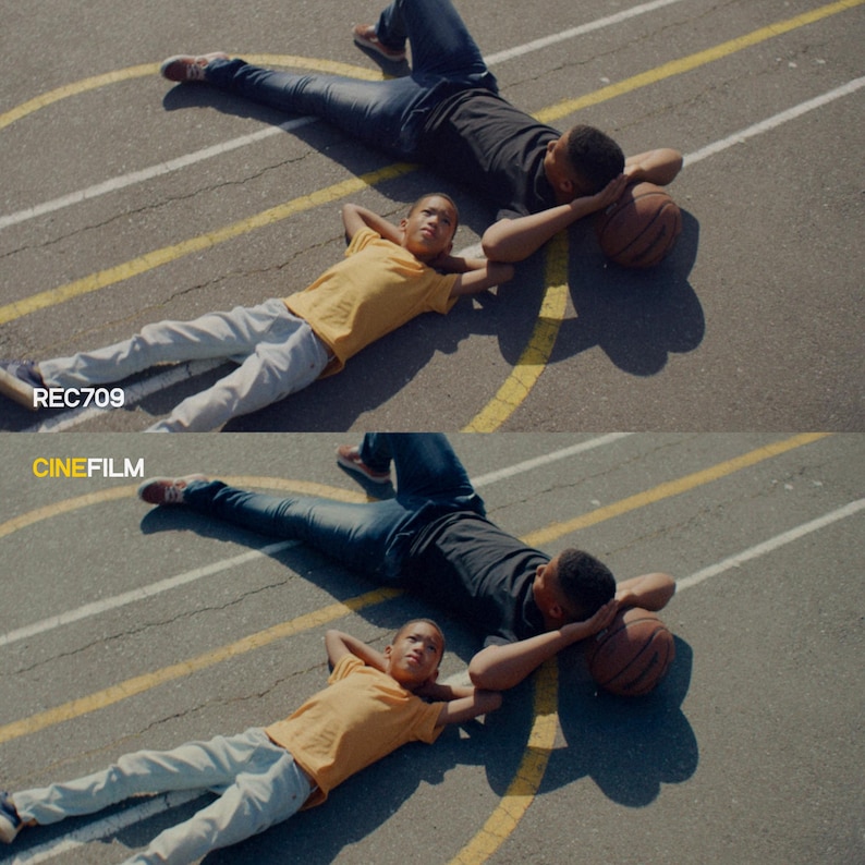 May include: Two people lying on a basketball court, one in a black shirt and jeans, the other in a yellow shirt and gray pants. A basketball rests near the person in black. The text "REC709" and "CINEFILM" are visible.