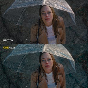 May include: A woman under a clear umbrella in the rain, wearing a tan trench coat and white shirt. The image is split, with "REC709" and "CINEFILM" text at the bottom, suggesting a comparison of visual styles.