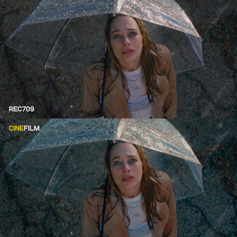 May include: A woman under a clear umbrella in the rain, wearing a tan trench coat and white shirt. The image is split, with "REC709" and "CINEFILM" text at the bottom, suggesting a comparison of visual styles.