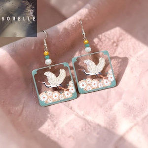 May include: A trio of ceramic mugs with a speckled, matte finish in cream, light brown, and dark brown. Each mug features a minimalist design and a rounded handle.