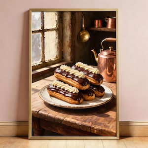 May include: A framed print showing a plate of eclairs with chocolate icing and cream topping. The scene includes a copper kettle, a window, and a wooden table. The image evokes a cosy, traditional kitchen setting, with warm, inviting tones.