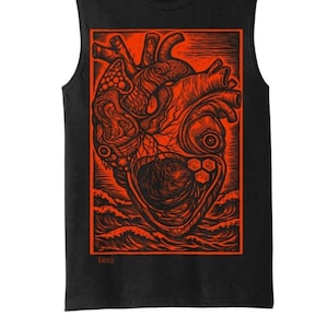 May include: Black vest top with a striking red graphic of a human heart, showcasing intricate anatomical details. The heart is set within a rectangular frame above stylized waves. The artist's name, "KAERIE," is printed at the bottom.