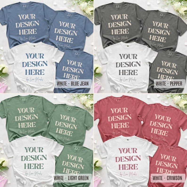 Puede incluir: Una colecci&oacute;n de ocho camisetas de manga corta y cuello redondo en colores azul, gris, verde y rojo. Cada camiseta presenta el texto YOUR DESIGN HERE impreso en una fuente serif negrita en el pecho. Las camisetas est&aacute;n dispuestas en cuadr&iacute;cula.