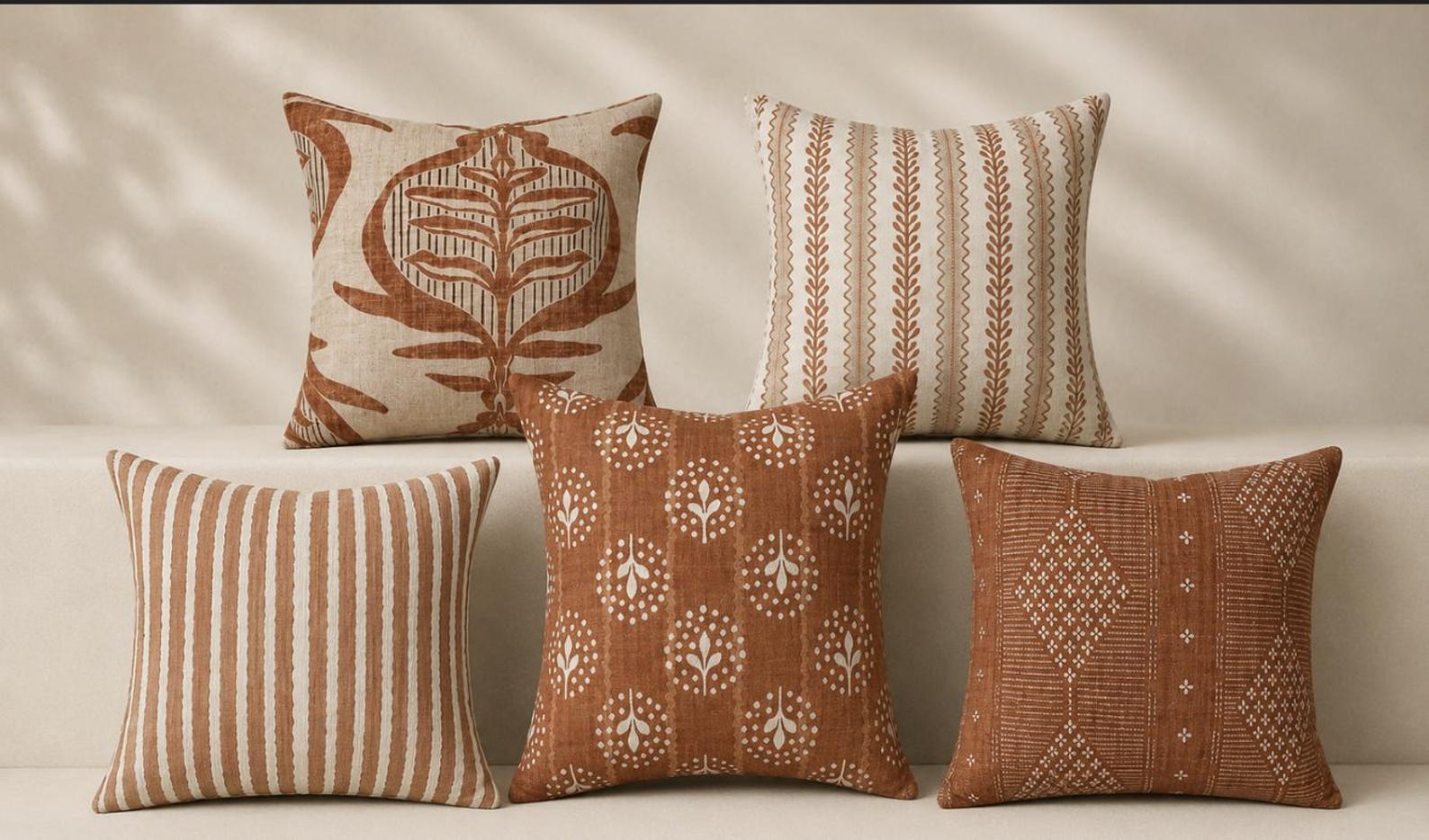 Terracotta folk art accent pillow with artisan-inspired pattern for a cowgirl coastal living room or bedroom