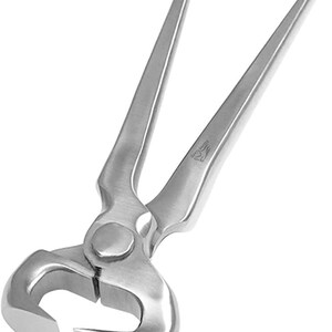 May include: A pair of silver-colored metal end cutting pliers featuring long, tapered handles and a rounded, heavy-duty head with sharp, flush-cutting jaws. The tool has a smooth, brushed finish and a small engraved logo on one of the handles.