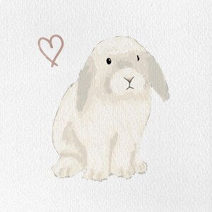 May include: Watercolor illustration of a seated white bunny with floppy ears and a small pink heart. The bunny has a fluffy appearance and is set against a white background. The artwork has a soft, gentle aesthetic.