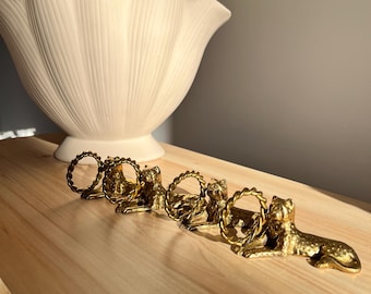 Set van 4 vintage messing Jaguar-servetringen | Bombay Company Mid Century-tafeldecor