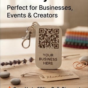 May include: A light-colored keychain with a QR code and the text "YOUR BUSINESS HERE". The keychain is attached to a silver clasp. The image also includes the text "Get More Followers Instantly".