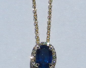 Natuurlijke Ceylon .83 karaats saffier en diamanten hanger 14kt geel goud