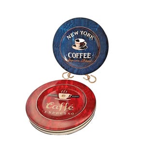 May include: Two round metal coasters featuring coffee-themed designs. The top coaster is dark blue with the text NEW YORK COFFEE Supreme Blend and a cup graphic. The bottom coaster is red with the text Caffé ESPRESSO and a cup graphic.