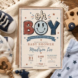 May include: A rectangular baby shower invitation card with a distressed, vintage-style design in red, white, and blue. The text reads: oh BOY, A LITTLE BABY BOY IS ON THE WAY!, PLEASE JOIN US FOR A BABY SHOWER HONORING Madison Lee, June 21 2026.