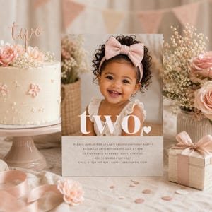 May include: A rectangular birthday invitation card featuring a photograph of a smiling child wearing a pink bow headband. The card displays the word two in large white letters, followed by event details including date, time, location, and contact information.