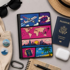 May include: A black passport holder with a colorful comic book-style design featuring an airplane, world map, city skyline, and beach scene. The holder has a black border and the word "ZAP" in a speech bubble.