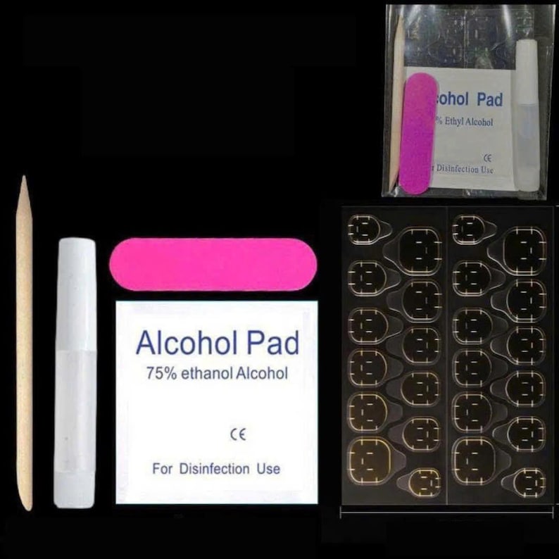 May include: A nail kit with various components for manicure application. Includes a wooden cuticle pusher, a white glue tube, a pink emery board, an alcohol pad, and a sheet of adhesive nail tabs. The alcohol pad reads "75% ethanol Alcohol".