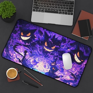 May include: A rectangular desk mat featuring a vibrant purple and black graphic illustration of multiple Gengar characters with glowing orange eyes and wide, toothy grins amidst swirling dark energy clouds and mystical purple light effects.