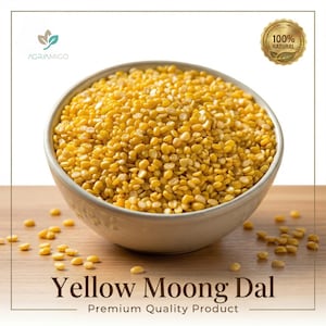 May include: A bowl filled with yellow moong dal, a type of split lentil. The image features the text "Yellow Moong Dal" and "Premium Quality Product". A "100% Natural" seal is visible in the upper right corner. The bowl sits on a wooden surface.