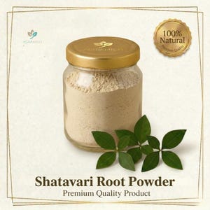 May include: A glass jar filled with light brown Shatavari root powder, topped with a gold lid. The jar is next to a sprig of green leaves. Text reads "Shatavari Root Powder" and "Premium Quality Product."
