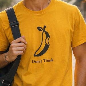 Don't Think Tech Spoof T-Shirt, Banana Bite Parody Graphic Tee, Minimalist Humor Apparel, Funny Silicon Valley Quote Shirt