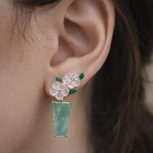 May include: A set of three ceramic mugs with a speckled, matte finish. The mugs are in shades of cream, light gray, and dark gray. Each mug has a simple, minimalist design and a rounded handle. The mugs are suitable for coffee, tea, or other beverages.