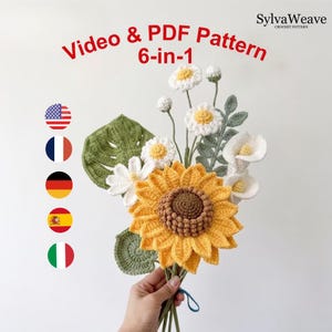 Peut inclure: Un modèle au crochet intitulé Video & PDF Pattern 6-in-1 par SylvaWeave représentant un bouquet de fleurs faites à la main, incluant un grand tournesol jaune, des marguerites blanches et des arums avec des feuilles vertes, et cinq drapeaux.