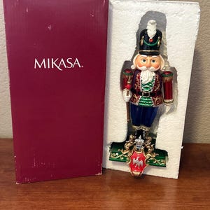 Mikasa-Resin Enamel Painted Nutcracker W/Baton Stocking Holder- 10.5”-Festive Christmas- FC 190/903-