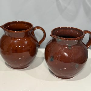 Two East Tennessee redware pottery pitcher