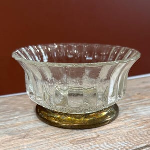 May include: A set of three ceramic mugs with a speckled, matte finish. The mugs are in shades of cream, light gray, and dark gray. Each mug has a simple, minimalist design, perfect for coffee or tea.