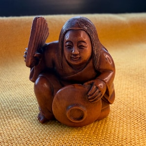 May include: A rustic wooden sign with the text "Welcome to our home" in white lettering. The sign features a distressed finish and a simple, inviting design, perfect for entryway decor.