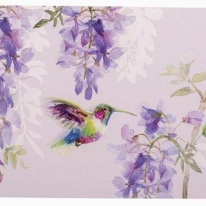May include: A watercolor painting of a hummingbird in flight, with wings spread, approaching purple wisteria flowers. The bird has colorful plumage, with green, blue, and pink hues. The background is a soft, pale lavender.