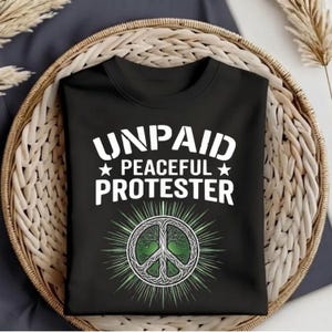 May include: A set of three ceramic mugs with a speckled, matte finish in cream, light grey, and dark grey. Each mug has a simple, minimalist design and a rounded handle. Ideal for tea or coffee.