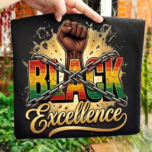 May include: Black t-shirt featuring a raised fist graphic above the word "BLACK" in colorful letters, crossed with a chain. Below, the words "Excellence" are written in a gold, cursive font. The design has a gold and brown background.