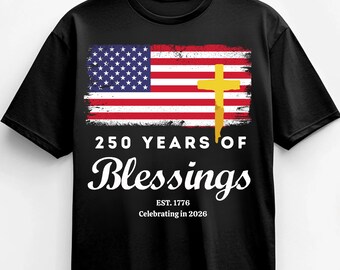 May include: Black t-shirt featuring an American flag design with a gold cross overlay. The shirt includes the text "250 YEARS OF Blessings" and "EST. 1776 Celebrating in 2026". A patriotic and religious themed apparel item.