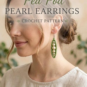 May include: A crochet pattern for Pea Pod Pearl Earrings. The design features a green crocheted pod shape containing five white spherical pearls arranged in a vertical line, suspended from a silver-toned metal earring hook.
