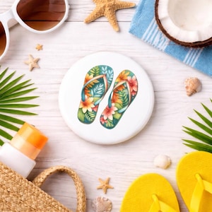 May include: A white ceramic mug with a black handle and the text "But first, coffee" in a handwritten style. The mug is on a white surface. The mug is 4 inches tall.