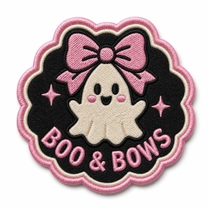 May include: A circular embroidered patch with a scalloped edge featuring a cream-colored ghost with pink cheeks wearing a large pink bow. The background is black with two small pink stars and the text BOO & BOWS in pink capital letters.